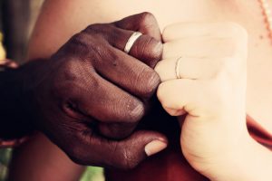 A close up of two hands with wedding bands. This could represent the deeper connection cultivated by a premarital counselor in Phoenix, AZ. Learn more about premarital counseling in Phoenix, AZ by contacting a therapist in Arcadia, AZ today.
