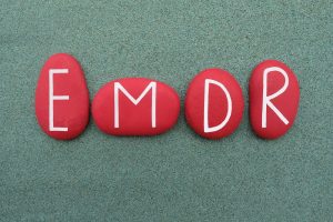 Four rocks spell out EMDR for Crossroads Counseling. Learn more about EMDR therapy in Phoenix, AZ by contacting an EMDR therapist in Phoenix, AZ. We offer trauma therapy in Arcadia, AZ and other services.